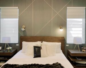 green geometric feature wall in bedroom with dual shades on both sides of the bed in Chicago IL