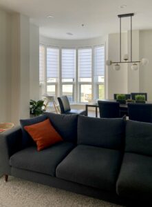 vignette modern roman shades on bay window area