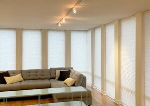 floor to ceiling narrow windows covered with honeycomb shades in Chicago condo