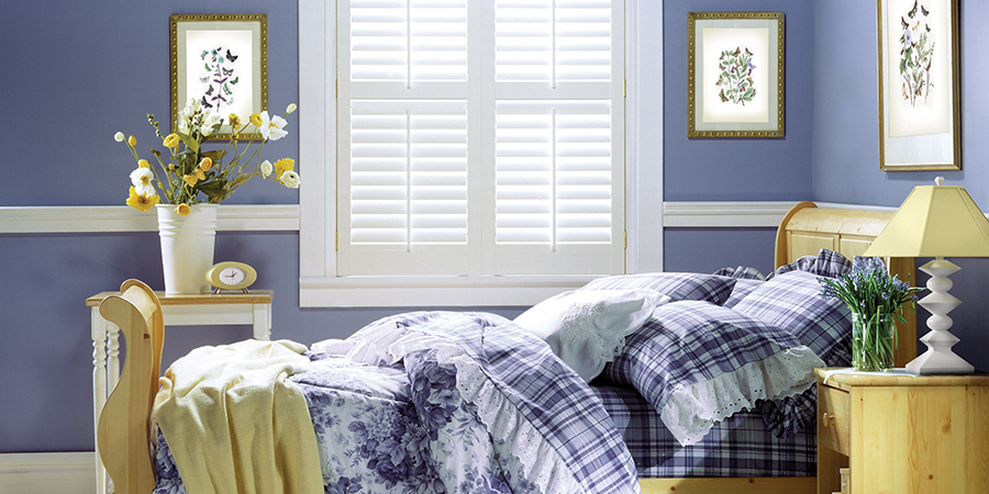 hunter douglas white shutters in periwinkle bedroom, chicago, IL