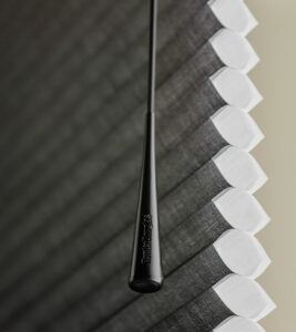 up close detail of operating wand for soft touch window treatment solution Chicago, IL
