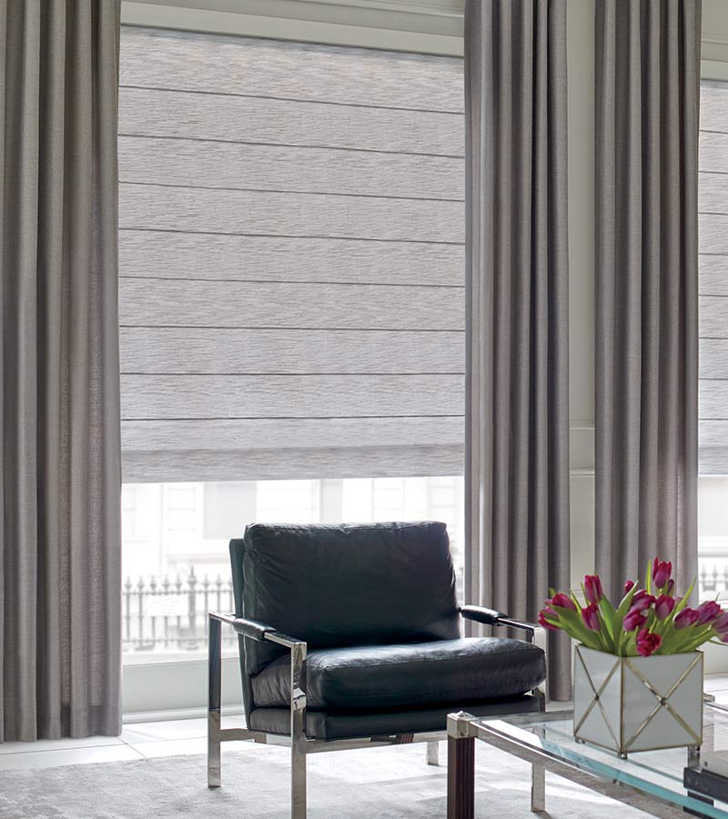 modern seating area with floor to ceiling drapery for large windows Wilmette, IL