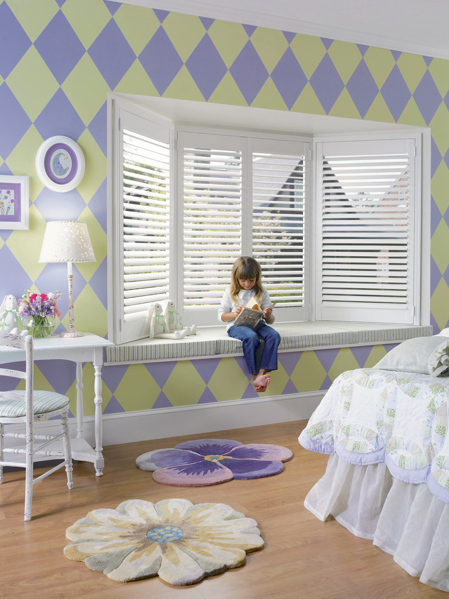 bay window shutters in childs room with green and purple wallpaper Chicago, IL