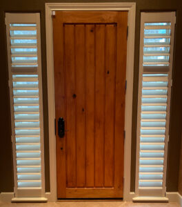 front entryway with shutters on sidelights narrow windows