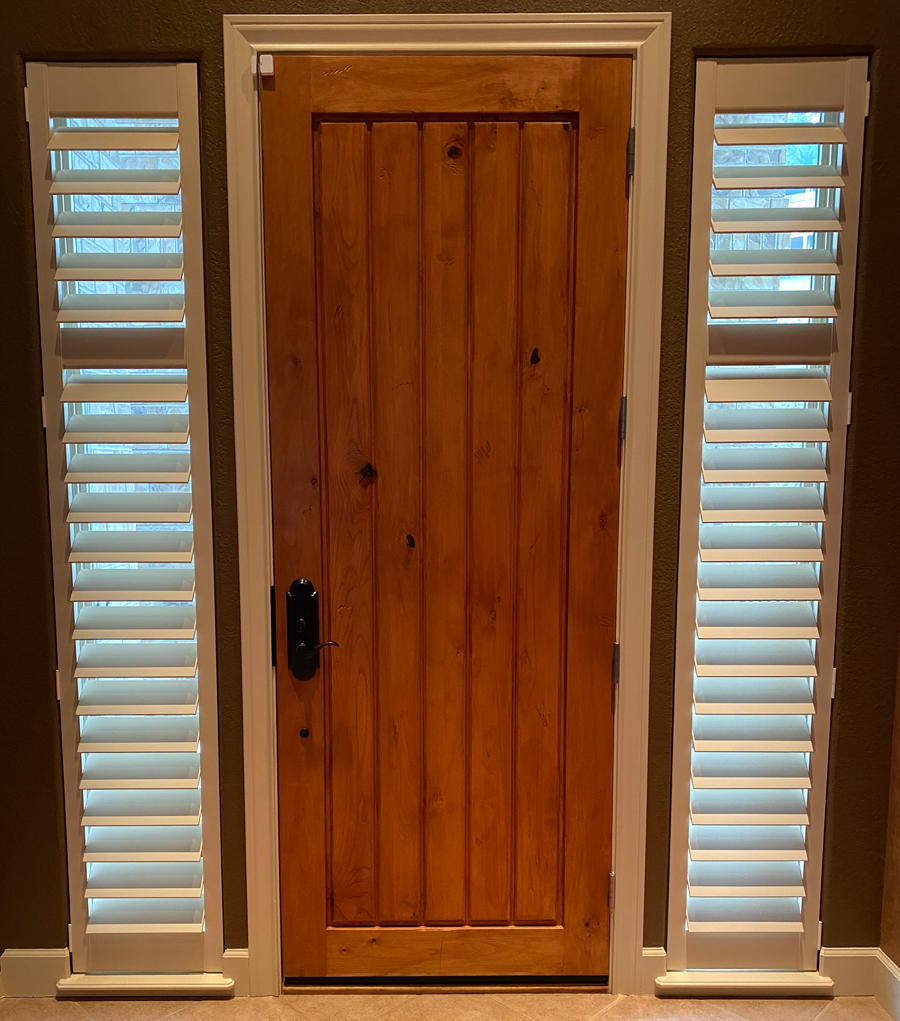 front entryway with shutters on sidelights narrow windows