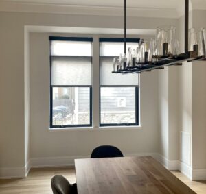 grey roller shades black headrail dining room