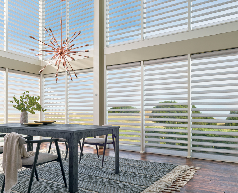 dining room table in exterior glass windows.