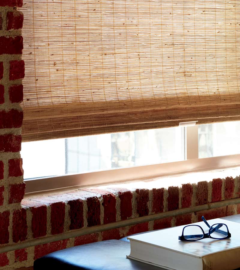 detail of custom woven shades in exposed brick apartment building chicago, IL