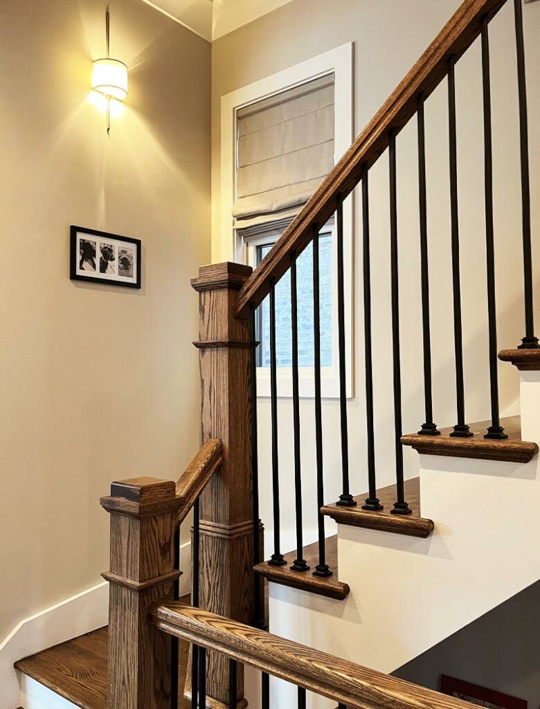 stairwell window shades and brown wood railing North Shore, IL