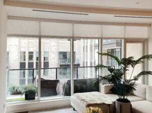 condominium window shades white sectional and faux palm leaf plant Portland, OR