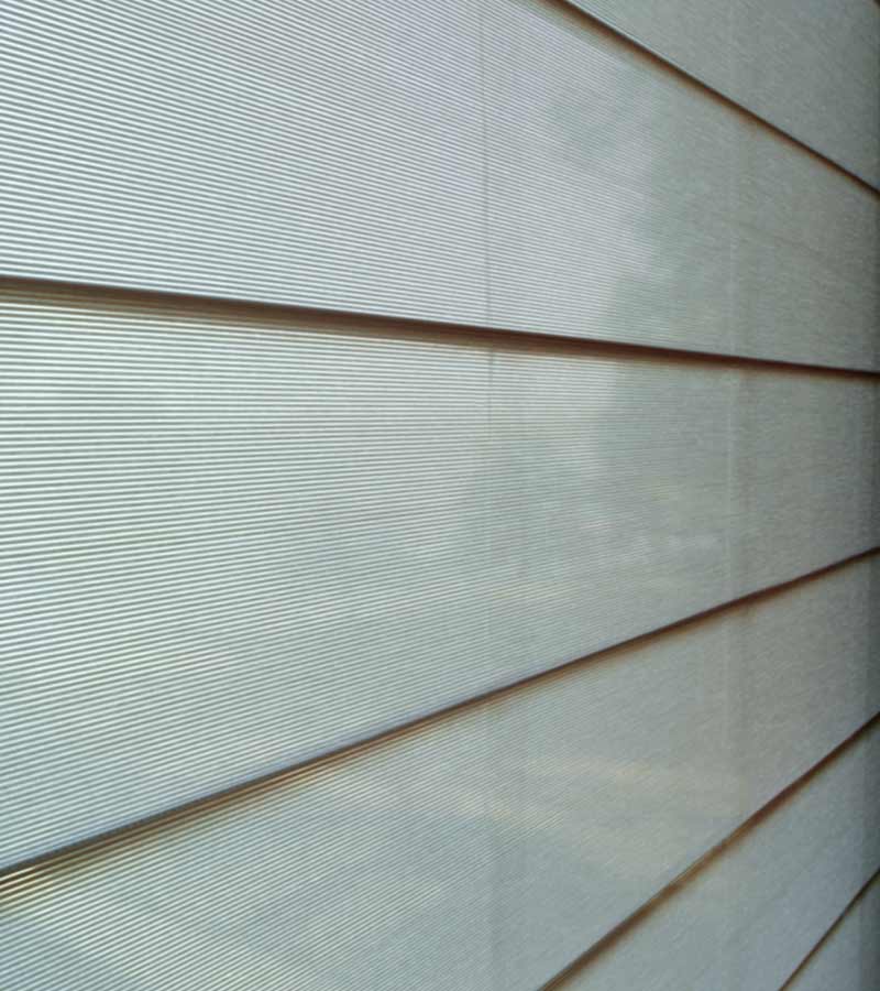 Side detail of alustra sheer shades and vanes on glass door in Hinsdale, IL