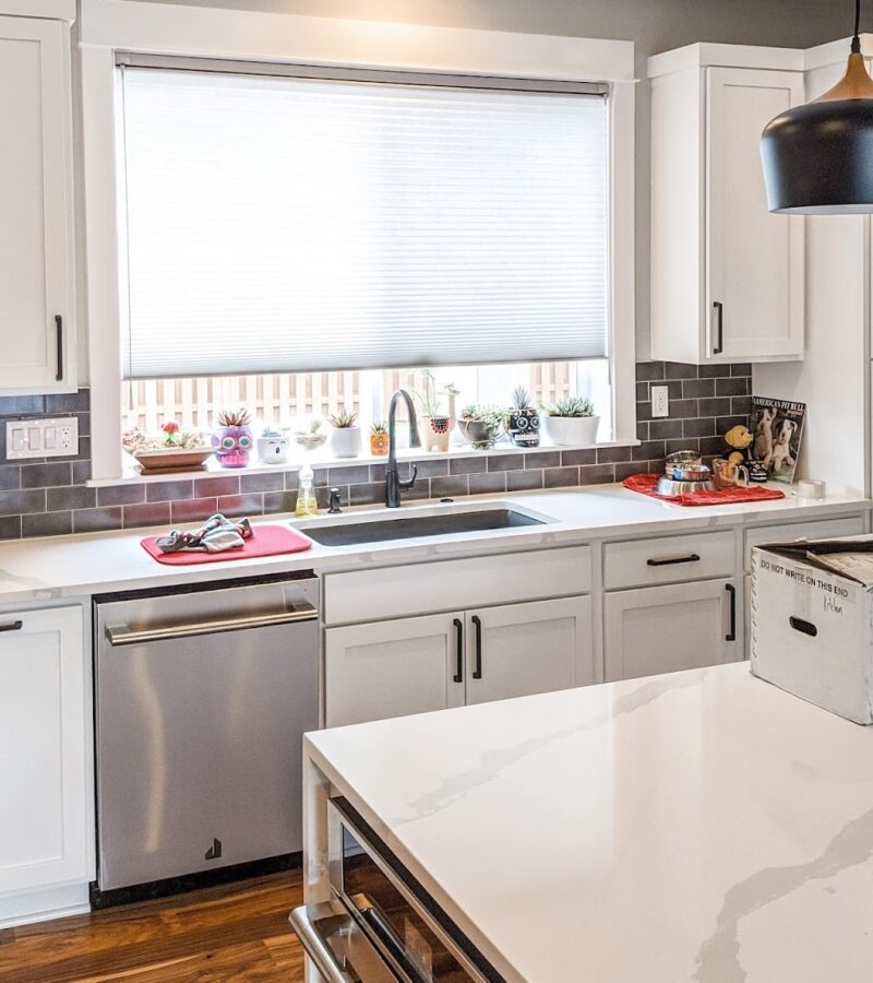 window over kitchen sink with alustra fabric motorized shade in Chicago home