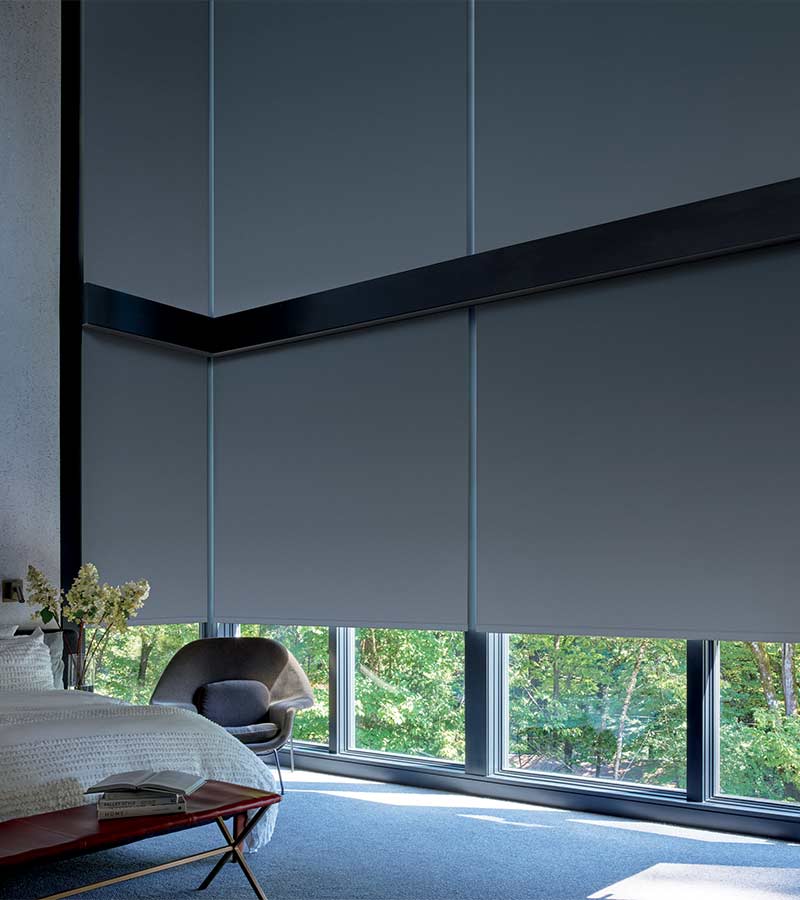 Large corner windows with floor to ceiling roller shades for room darkening Winnetka, IL