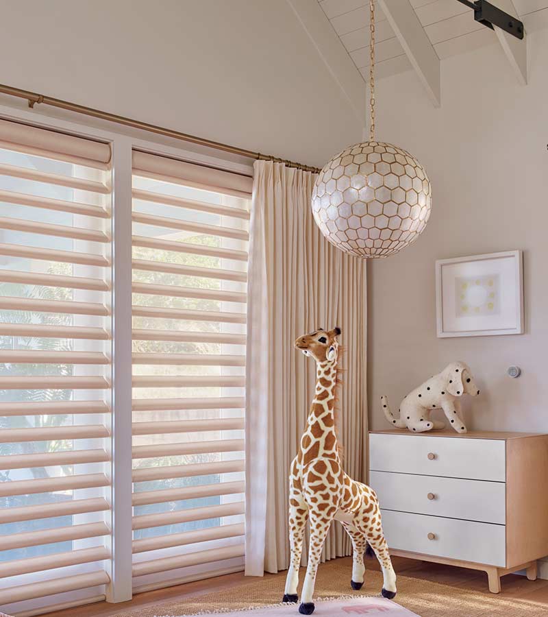 pastel baby nursery floor to ceiling drapery and hunter douglas window shades Winnetka, IL