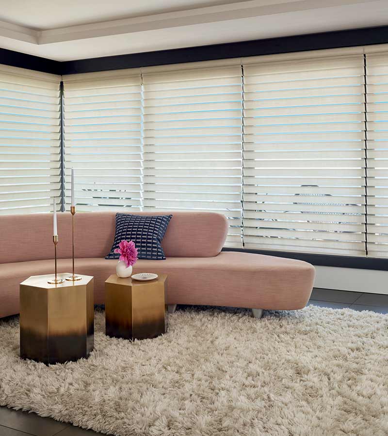 contemporary living room pink couch and silhouette hunter douglas shades