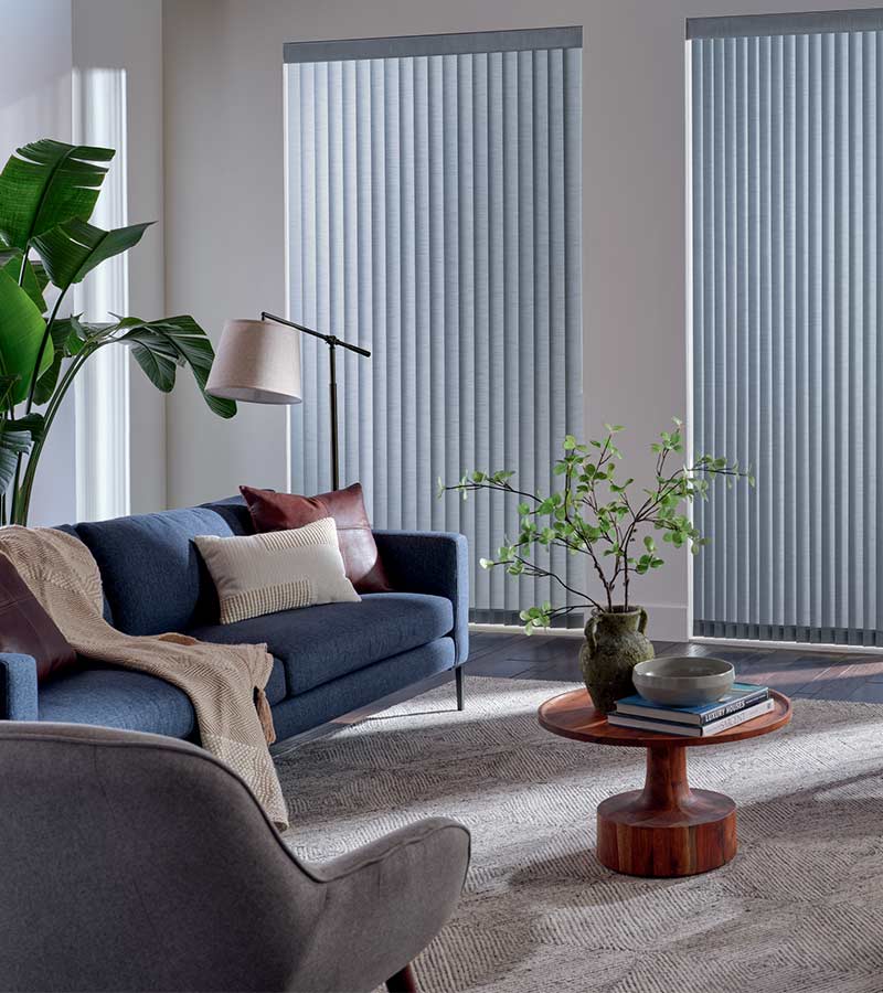 blue couch in living space next to vertical shades in soft blue fabric Westlake Village, CA