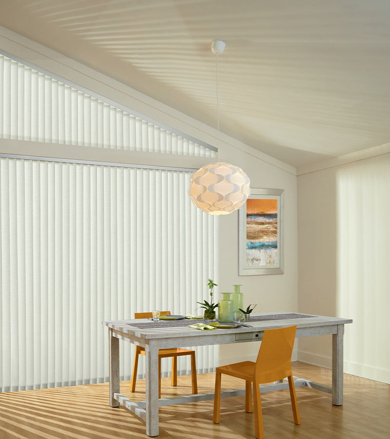 angled window with interior vertical shadings next to modern farmhouse dining room table Chicago, IL