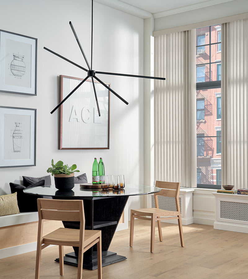 apartment living space with floor to ceiling window shades, white oak floors, and dining room table Portland, OR