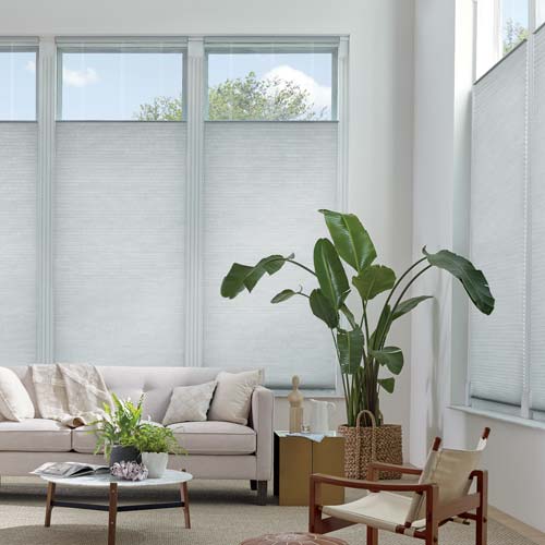 living room with gray window shades that lower from the top