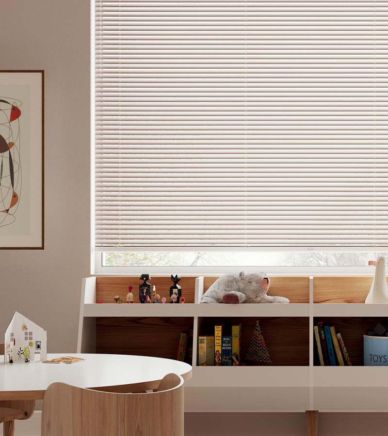 kids playroom with books and toys and beige blinds in Chicago, IL