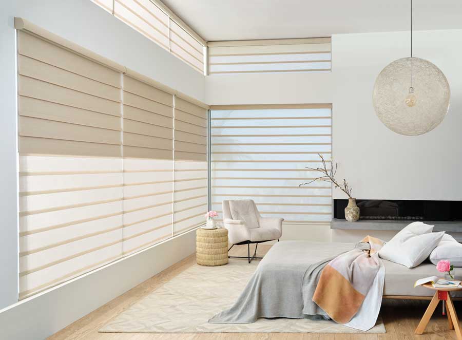 Light bedroom with wall to wall windows