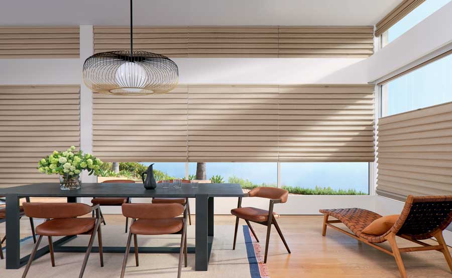 transitional dining room with textured roman shades and black table