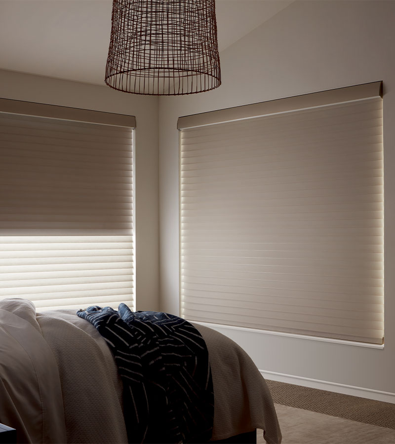 Room darkening and light filtering bedroom shade in beige guest bedroom