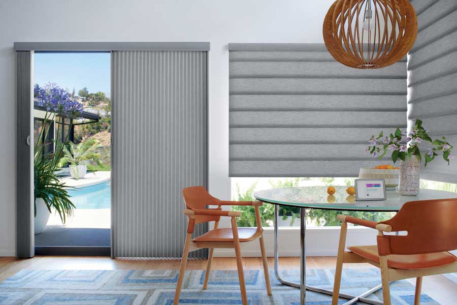 gray roman shades with brown woven pendant light over dining table