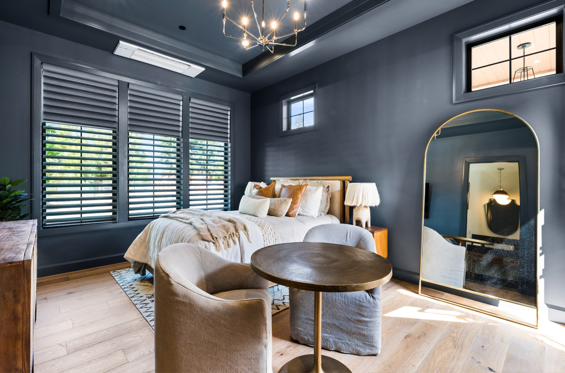 dual silhouette window shadings in dark theme bedroom for design trade program partner