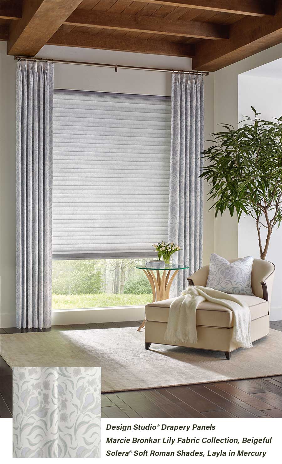 Living room with layered fabrics window treatments