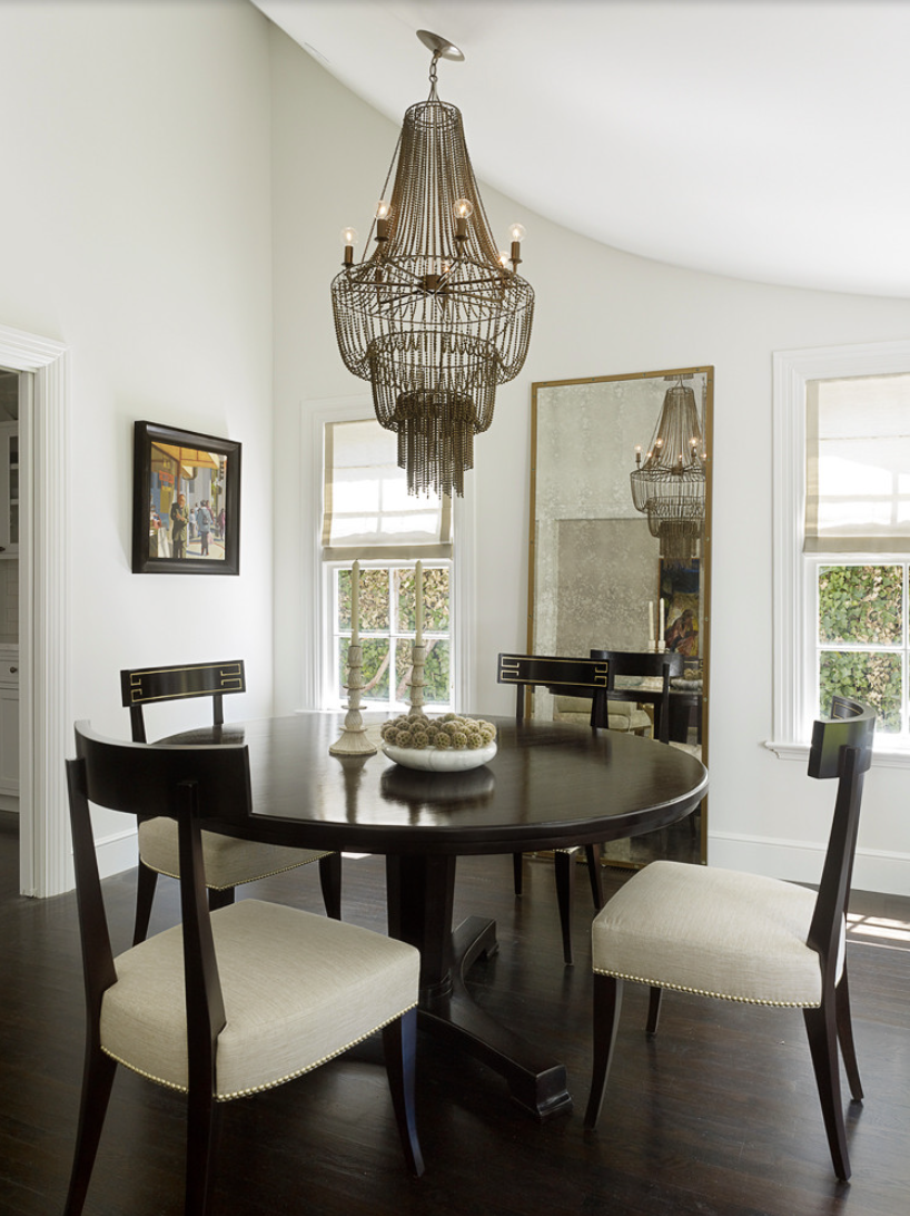 Tall floor mirror in dining room