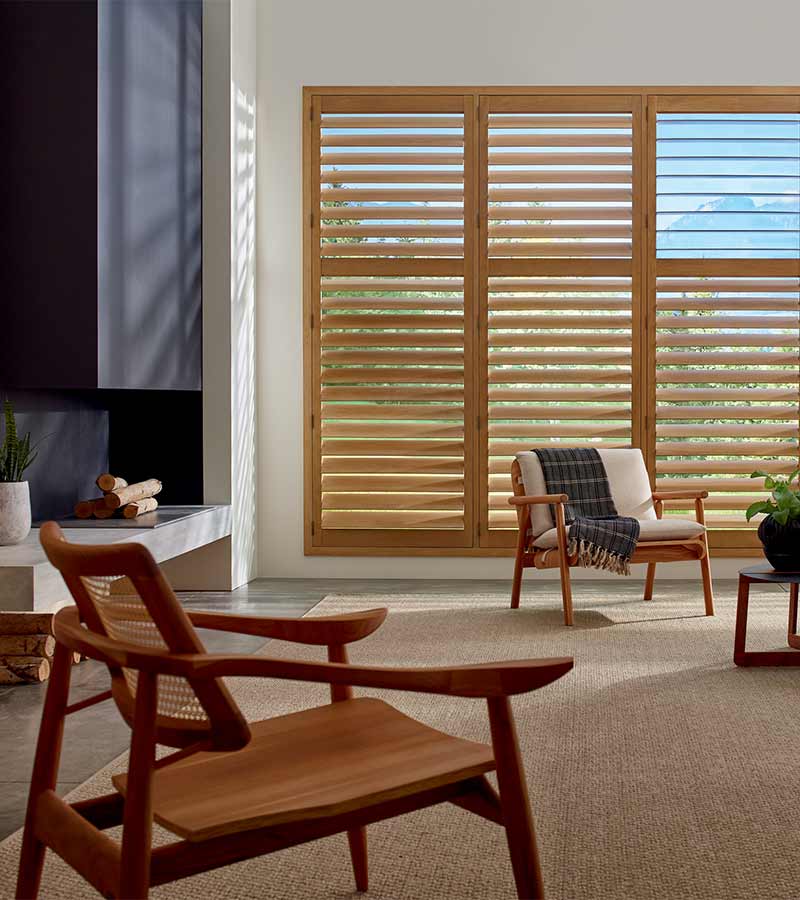 warm hardwood stained shutters floor to ceiling