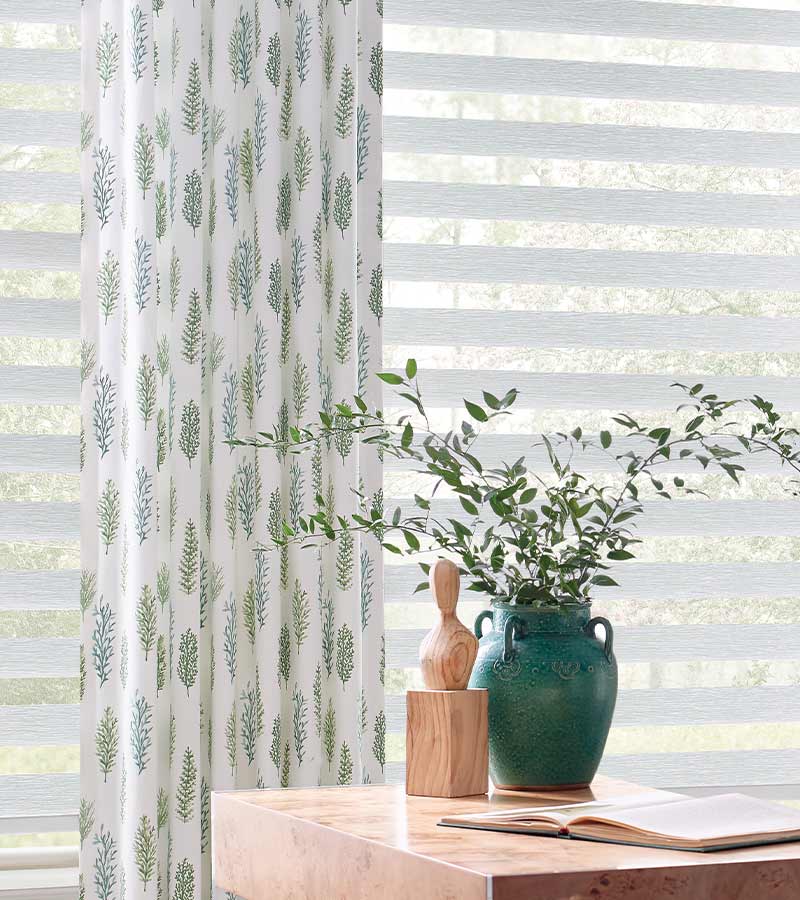 Leaf pattern on drapery with white banded window shadings