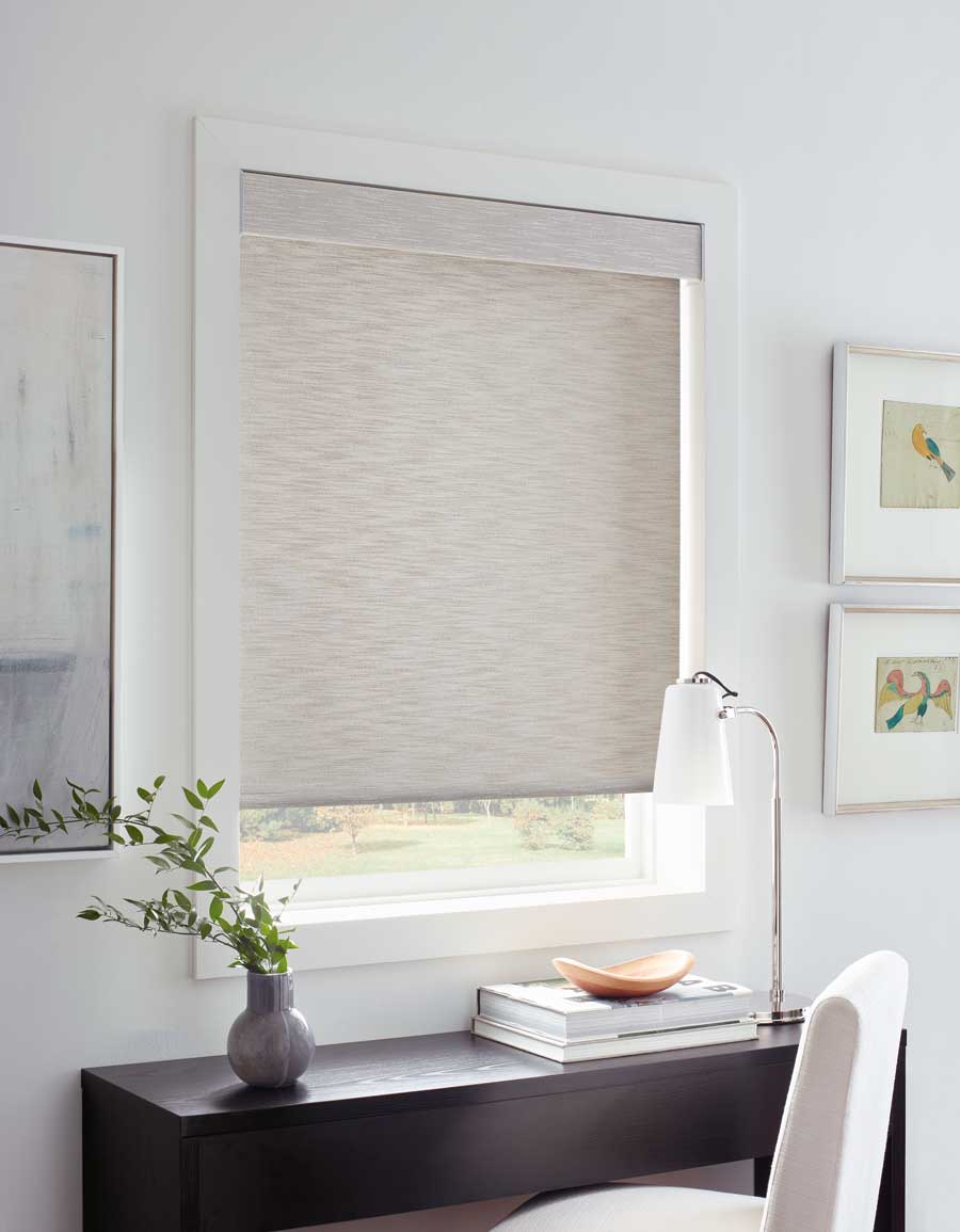 soft neutral roller shades on window above desk in a home office in Winnetka IL