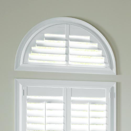 arched window with white rounded shutters