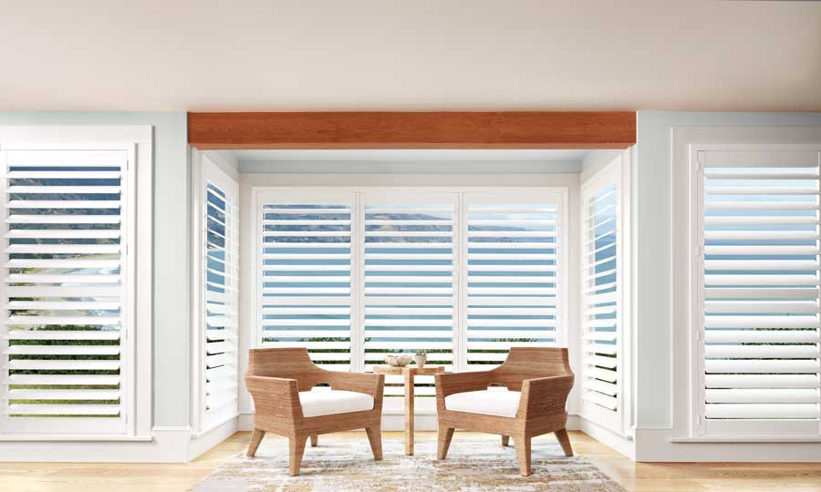 white shutters in small niche patio space