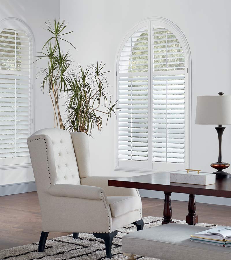 arched window treatments as white shutters in Naperville home office