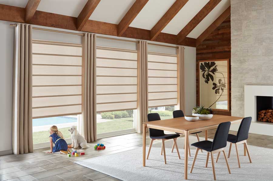 dining room with large windows covered with window shades while living with pets