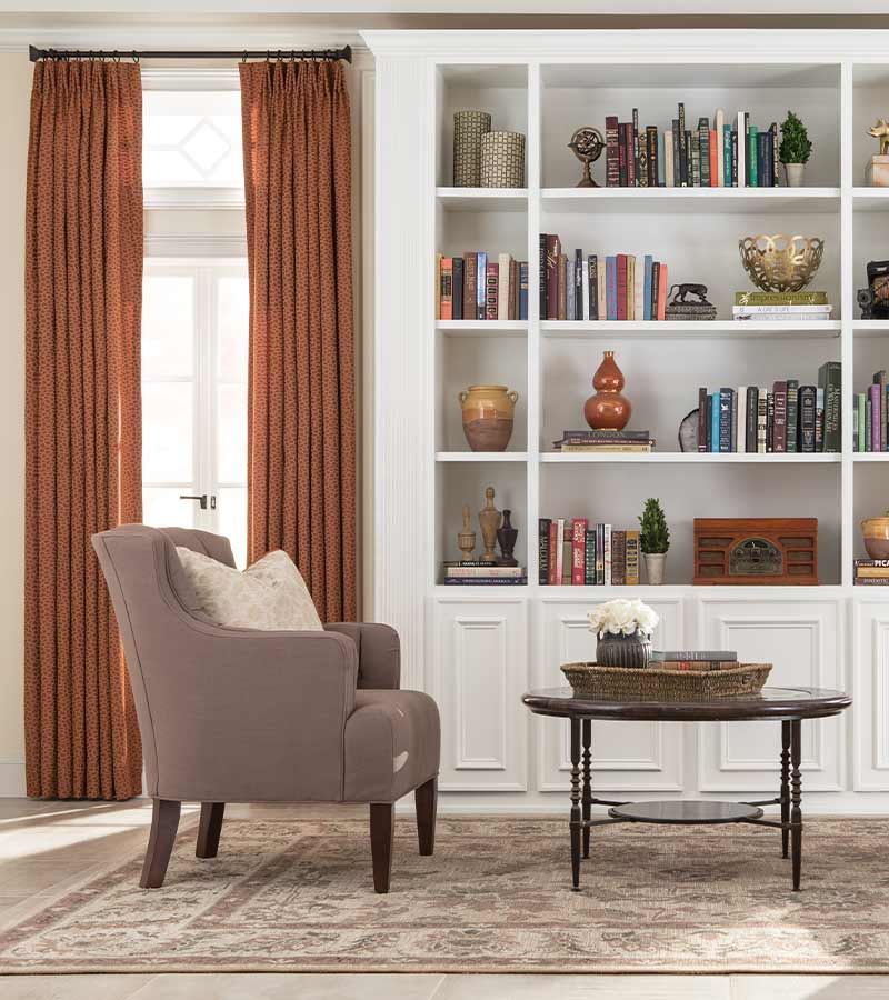 burnt orange curtain panels in home library