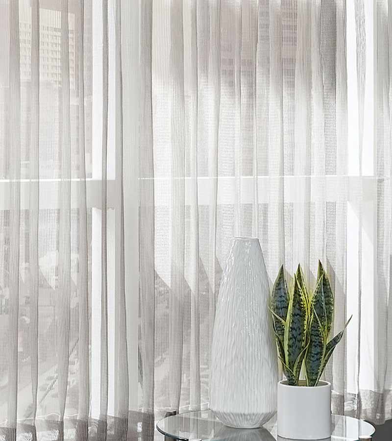 sheer curtains with light coming through for modern living room