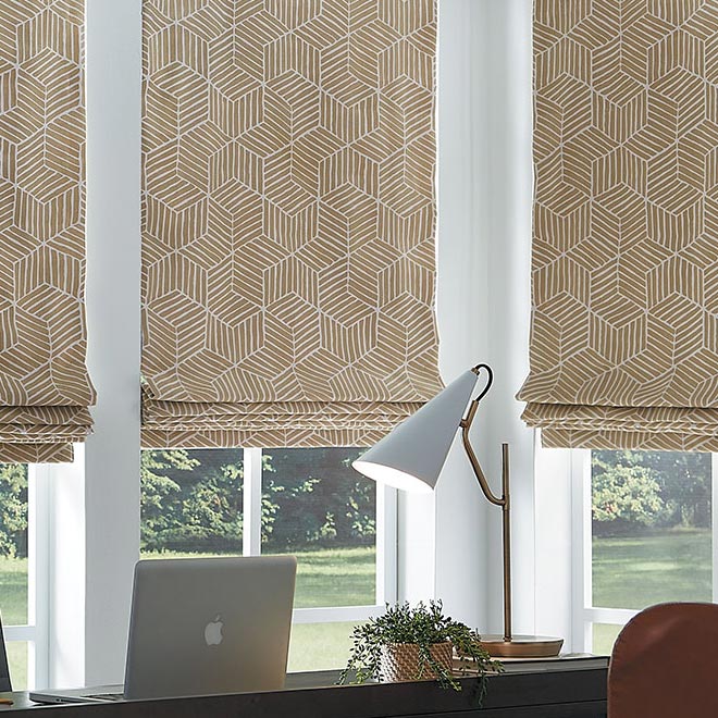 custom roman shades in a geometric gold pattern