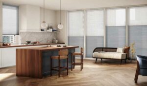 kitchen with tall windows covered with dual cellular shades in gray fabric for large window covering ideas for chicago homes