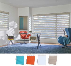 beige pirouette shades cover the large windows of this home office decorated with blues and accented with an orange chair