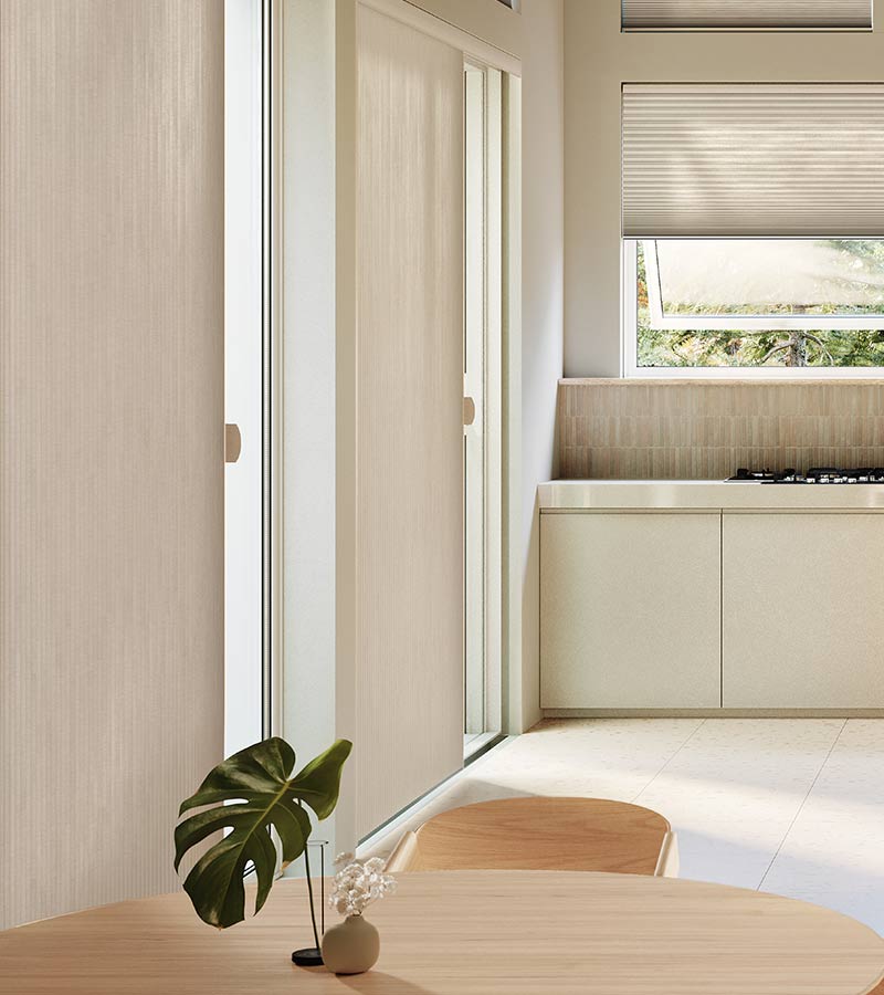 large glass doors in kitchen covered by vertical window shades in chicago home