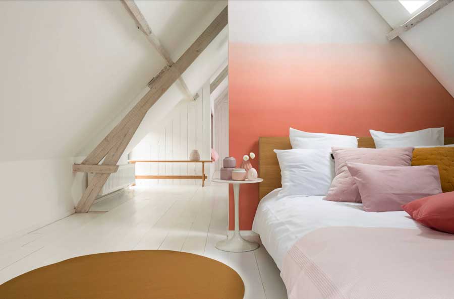 ombre peach colored wall in bedroom