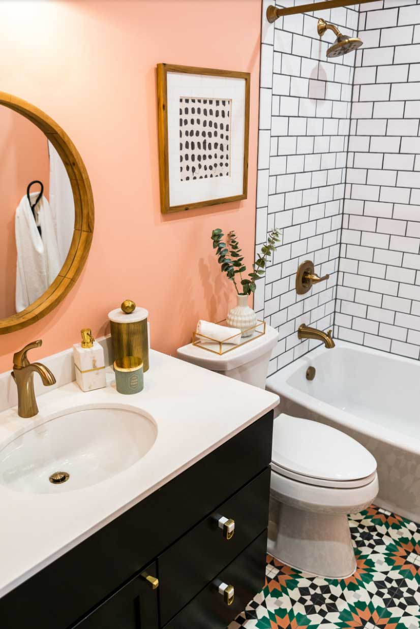 peach painted wall in black and white bathroom