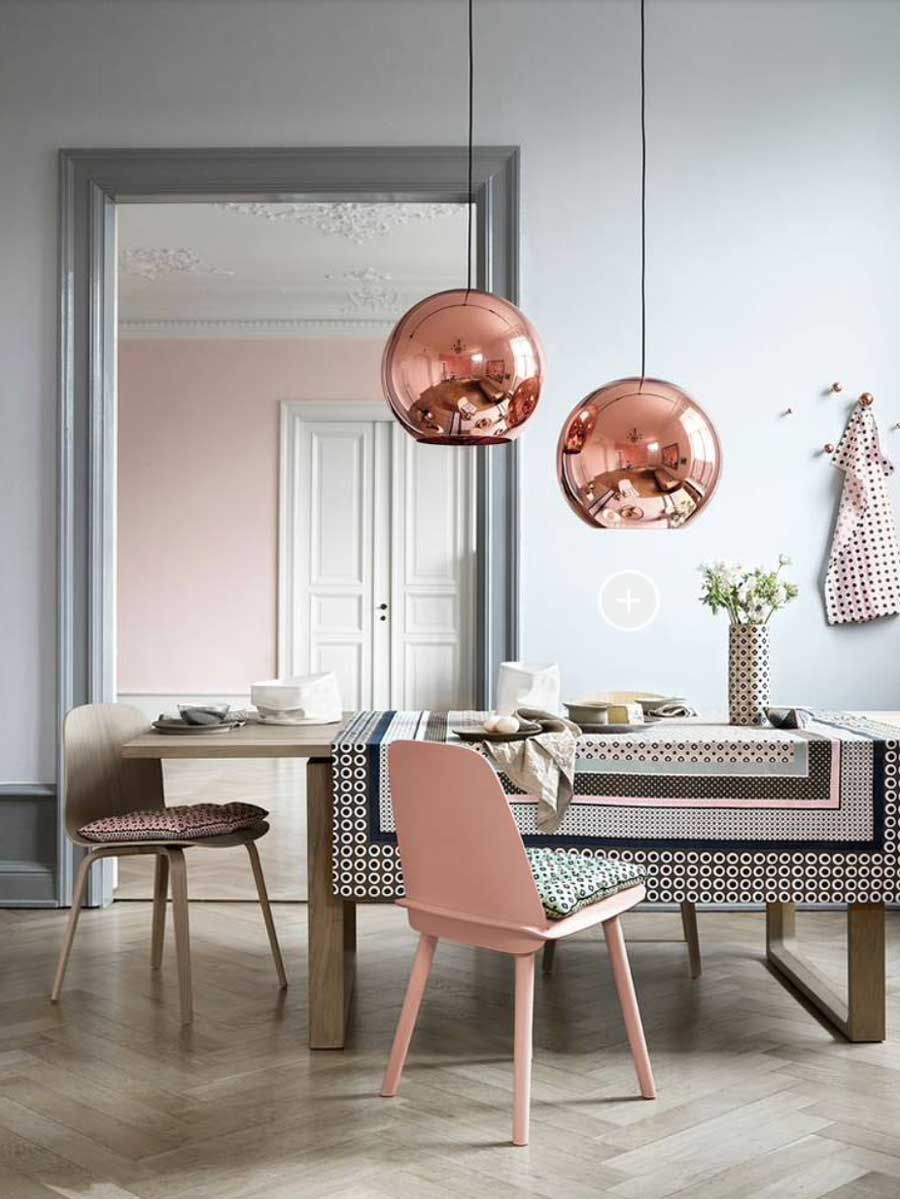 rose colored copper pendants in dining room