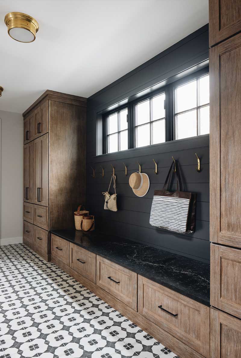 black and wood built in mudroom design