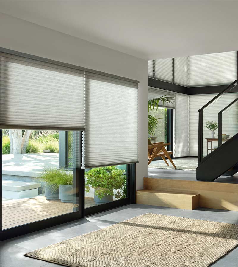 duette cellular shades on black trim sliding glass doors for outdoor access