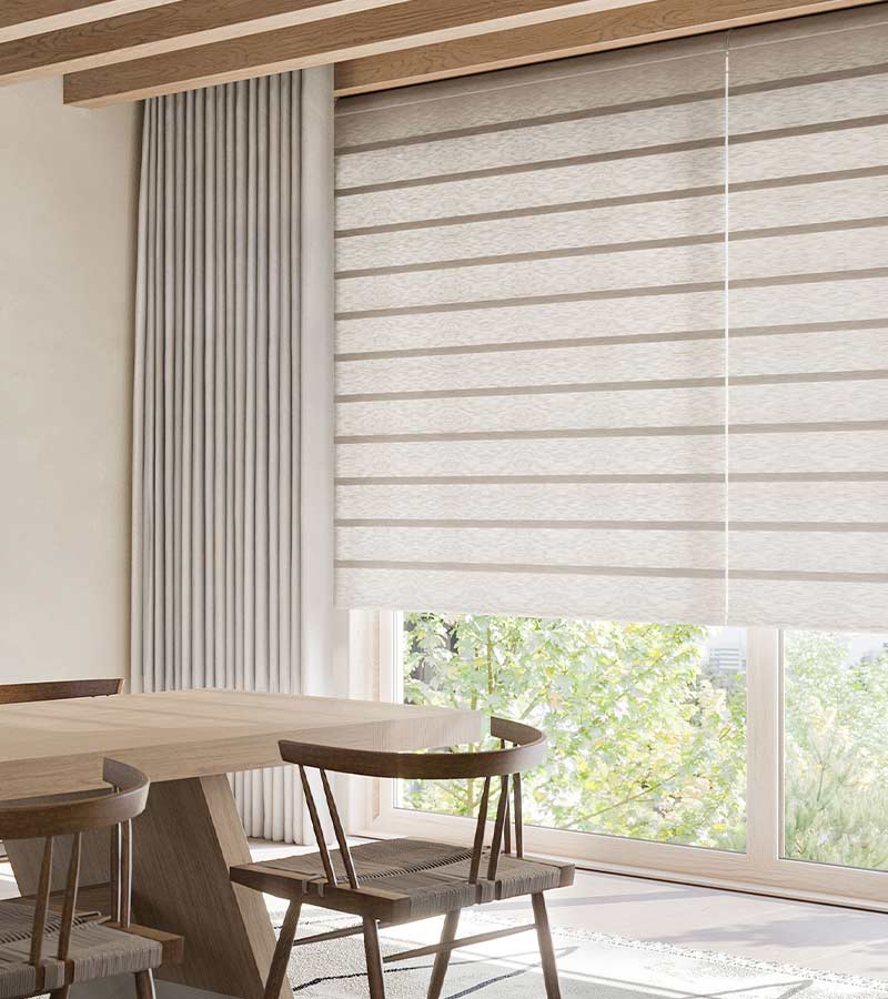 drapery and flat rolling shades together on window in modern farmhouse dining room